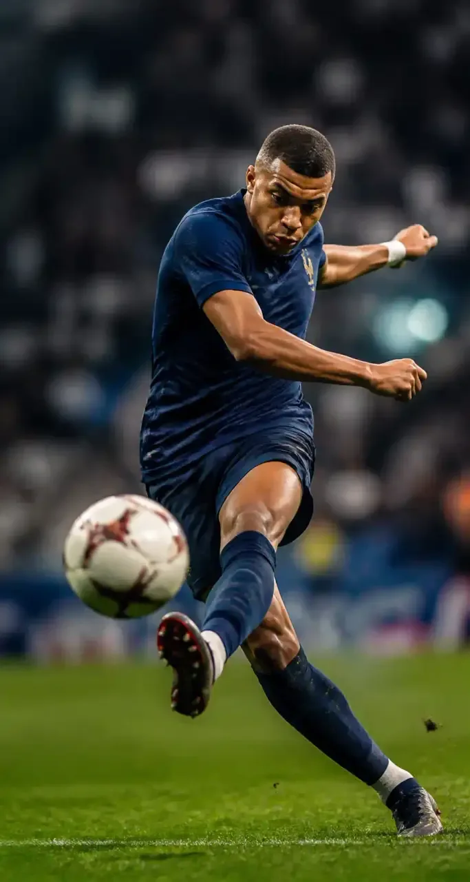 Joueur de football professionnel à l'action dans un stade